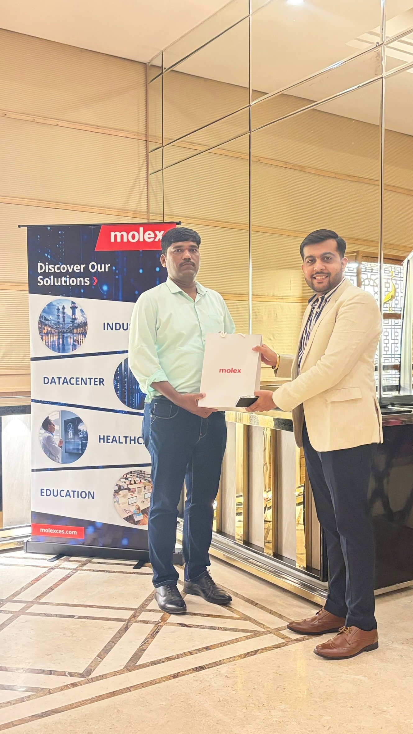 Molex partner meet — gift handover to a channel partner